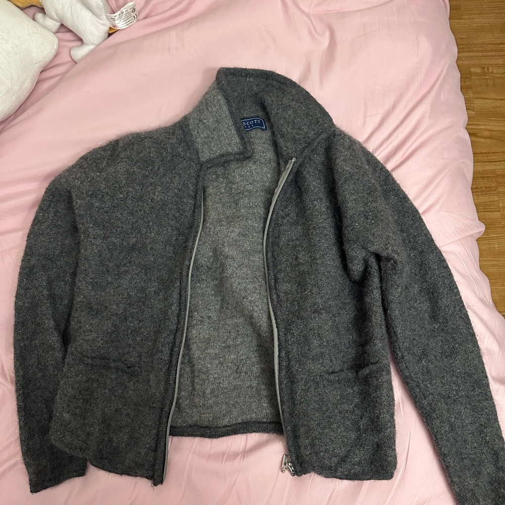 A vintage grandma sweater It has shoulders pads inside,small hole not noticeable